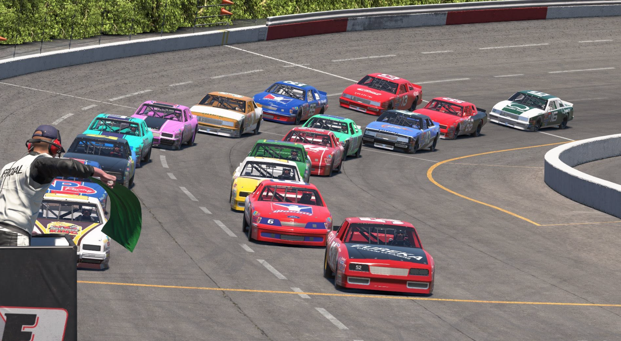 A colorful field taking the green flag on a short oval